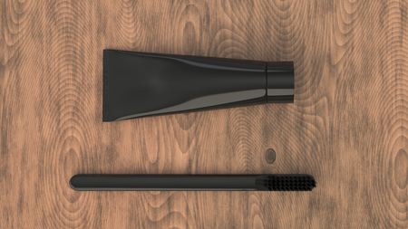 Blank black tube of toothpaste and toothbrush on wooden background. Branding or medical mockup. 3D rendering illustrationの写真素材