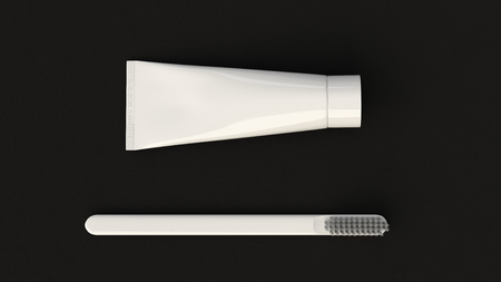 Blank white tube of toothpaste and toothbrush on black background. Branding or medical mockup. 3D rendering illustrationの写真素材