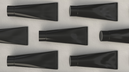 Pattern from blank black tube of toothpaste, cream or gel on white background. Branding mockup. 3D rendering illustrationの写真素材