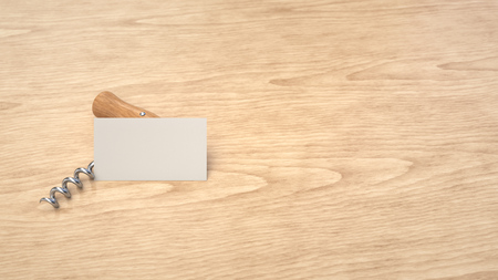 Wine or sommelier branding template. Mockup of white business card and corkscrew on wooden background. 3D rendering illustration.の写真素材