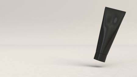 Blank black tube of toothpaste, cream or gel on white background. Branding mockup. 3D rendering illustrationの写真素材