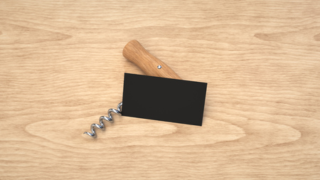 Wine or sommelier branding template. Mockup of black business card and corkscrew on wooden background. 3D rendering illustration.の写真素材