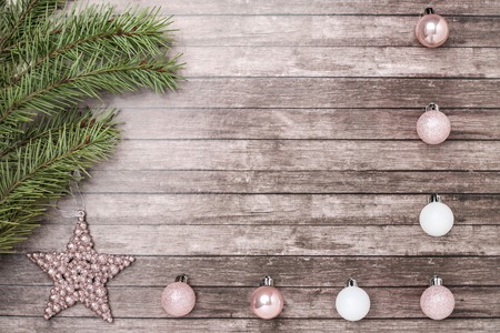 Christmas fir-tree and toys on wooden background. Flat lay, top view. Copy space.の写真素材