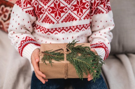 Christmas gift box in childs hands. Close-up. Merry Christmas and Happy New year.の写真素材