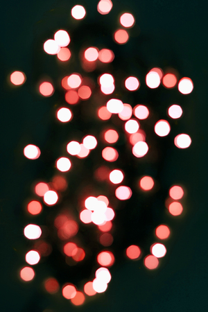 Festive sparkle backgroung in Living coral lights. Trendy colour 2019.の写真素材