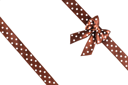 Shiny brown silk ribbon isolated on white background. Festive concept. Flat lay.の写真素材