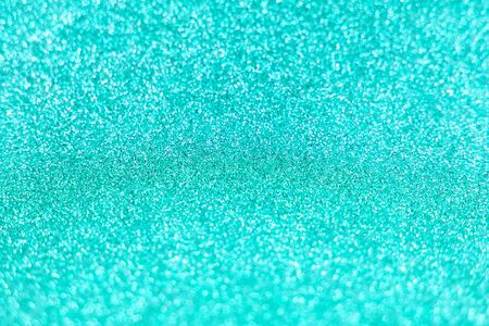 Bright sparkle aquamarine background. Holiday and festive concept. New year, Christmas, Wedding Day, Birthday.の写真素材