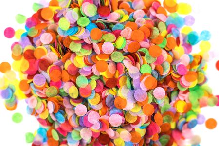 Heap of festive round paper multicolored confetti isolated on white. Festive concept.の写真素材