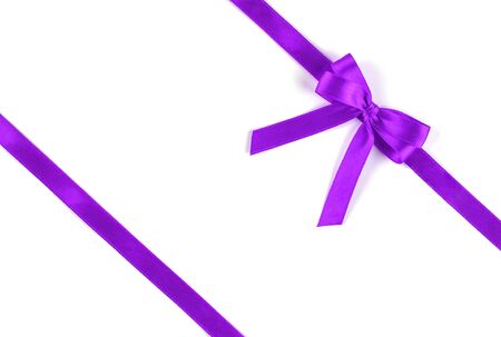 Shiny purple silk ribbon isolated on white background. Festive concept. Flat lay.の写真素材