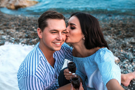 Romantic couple kissng and make selfie at sunset beach. Romantic concept.