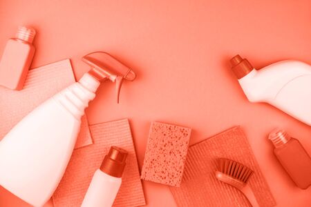 House cleaning products are on coral background. Cleaning concept.の写真素材