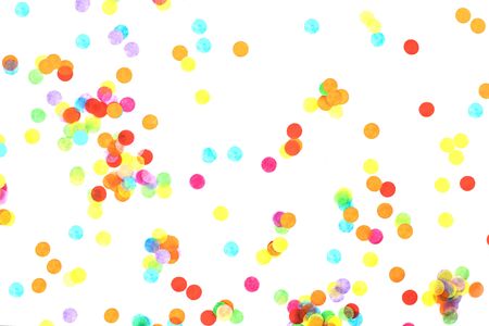 Bright multicolored confetti isolated on a white background. Festive concept. Childrens party, birthday, wedding, celebration. Top view. Copy space.の写真素材
