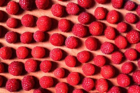 Fresh raspberry on wooden background. Flat lay style.の写真素材