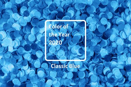 Blue confetti background. Flat lay style. Festive concept.の写真素材