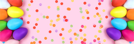 Banner made from colored Easter eggs on pink background with confetti. Flat lay.の写真素材