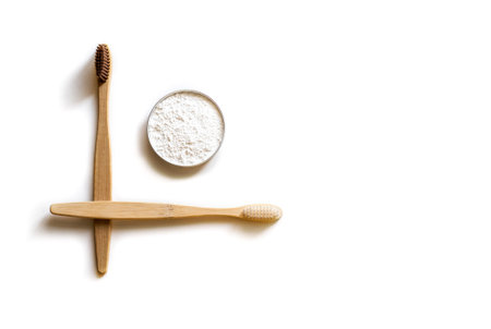 Two bamboo toothbrush with tooth powder isolated on white background. Zero waste concept.の写真素材