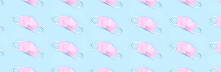 Banner made from of pattern of medical reusable masks. Flat lay style.