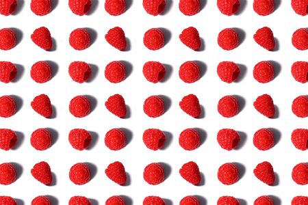 Pattern made of fresh summer raspberry isolated on white. Top view.の写真素材