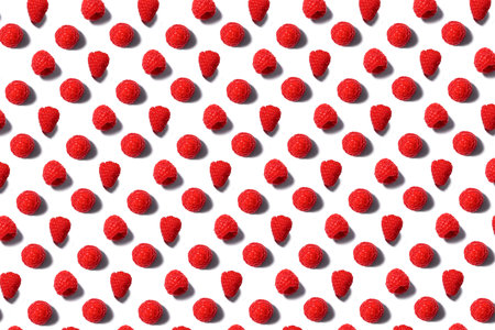 Pattern made of fresh summer raspberry isolated on white. Top view.