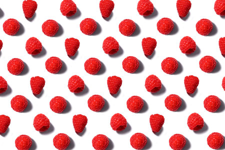 Pattern made of fresh summer raspberry isolated on white. Top view.