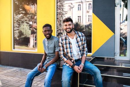Multiracial young friends laughing and having fun together at the street.の写真素材