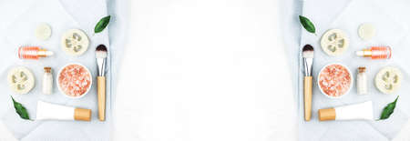 Banner made from homemade spa cosmetic set with salt and oil on white wooden background. Copy space. Flat lay style.の写真素材