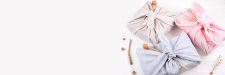 Banner with Christmas furoshiki wrapping. Zero waste concept. Flat lay.の写真素材