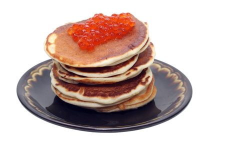 Photo of pancakes with caviar is isolated on a white background with path.の写真素材