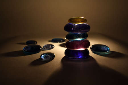 The lighted candles and balancing stones in Spa salonの写真素材