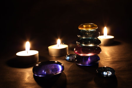 The lighted candles and balancing stones in Spa salonの写真素材