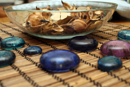 Dry flowers and leaves of fragrant plants, candles, stones in Spa salonの写真素材