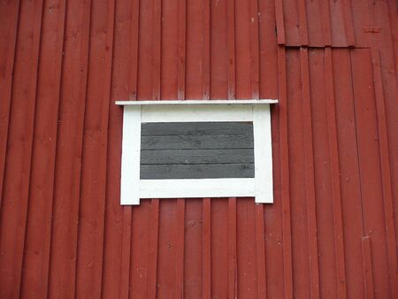 white frame on red wooden wallの写真素材