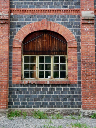 window of old industrial building at fiskars, south finlandの写真素材