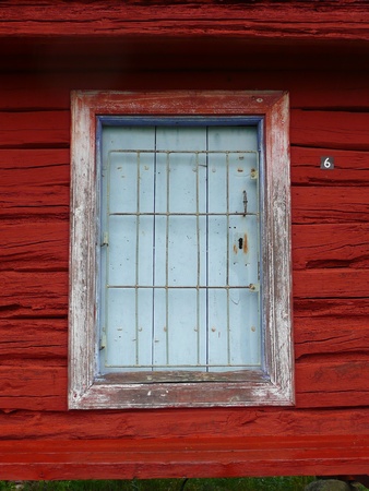 window on red wooden buildingの写真素材