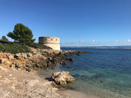 coastal view at torre del lazzaretto, alghero, sardinia, italyの写真素材