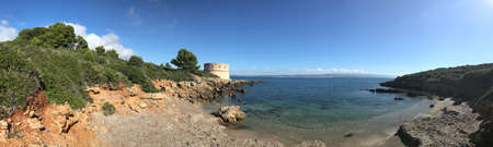 coastal view at torre del lazzaretto, alghero, sardinia, italyの写真素材