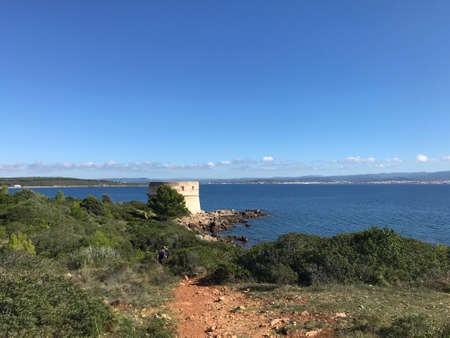 coastal view at torre del lazzaretto, alghero, sardinia, italyの写真素材