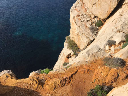 rocky coast in alghero, sardinia, italyの写真素材