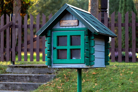 Green free book sharing mini house in nature at day.の写真素材