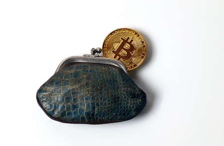 Vintage leather wallet with bitcoin in it on white background.の写真素材