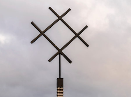 Photo of well water symbol in paganism against cloudy sky.