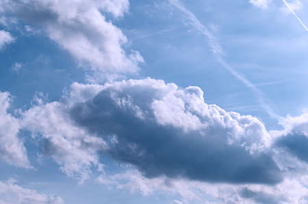 Fluffy clouds in the sky on sunny day.の写真素材