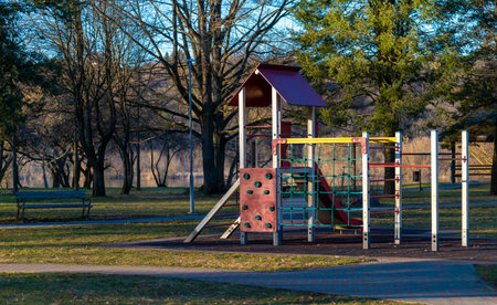 Colorful kids playground at the public park near the river.