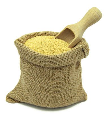 Amaranth in linen sack isolated on white background.の写真素材