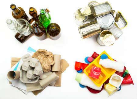 Segregated garbage - glass, metal, paper and plasticの写真素材
