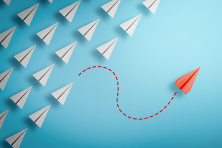 one red paper plane pointing in different way on blue background. Business for new ideas creativity and innovative solution concepts.の写真素材