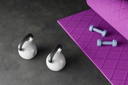 Sport background with copyspace. Top view of gray dumbbells ,black kettlebell and workout gloves. Weight lifting exercise concept.の写真素材