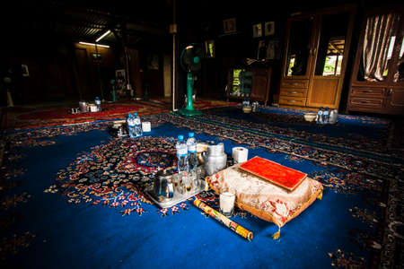 An Al Quran old book preparing for Muslim religious ceramony in Thailandのeditorial素材