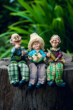 grandparents with child cute ceramic dollsの写真素材