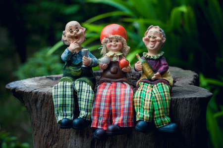 grandparents with child cute ceramic dollsの写真素材